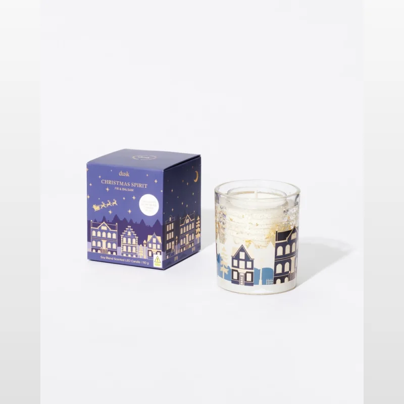 Dusk Christmas Spirit Soy Blend Scented LED Candle with a festive village design on the glass and box.