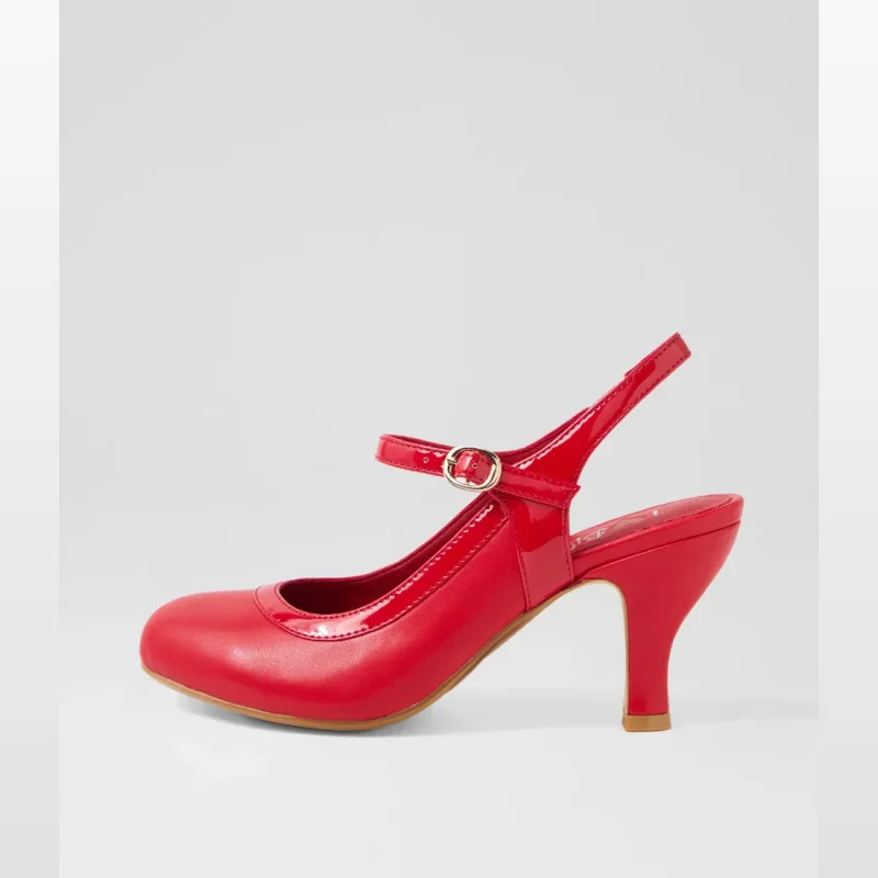 Side view of a red patent PU slingback heel with a buckled ankle strap and a medium heel.