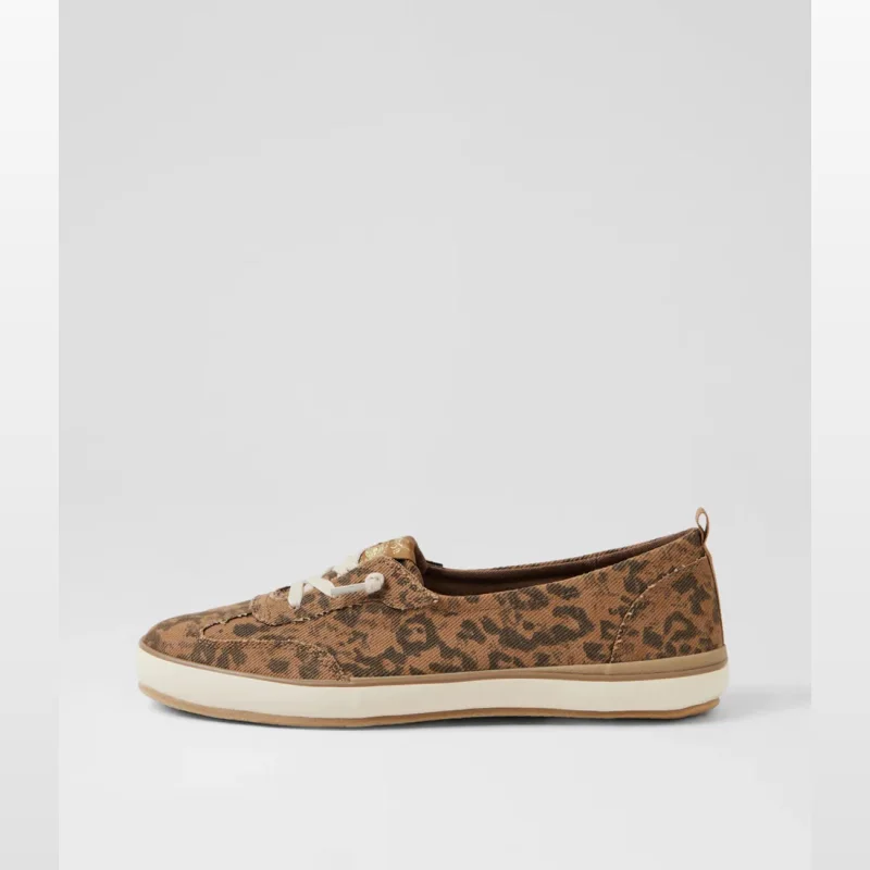 Side view of a tan canvas sneaker with a leopard print pattern and white laces.