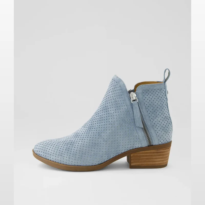 Side view of a light blue suede ankle boot with laser-cut detailing and a stacked low heel.