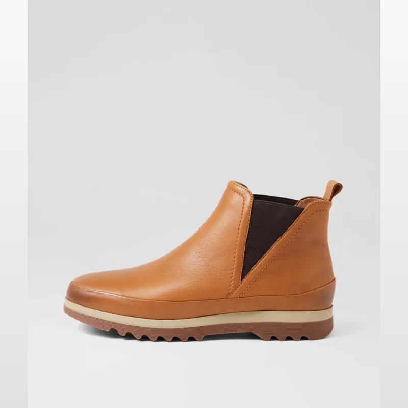 Side view of a tan brown leather ankle boot with elasticated sides and a thick sole.