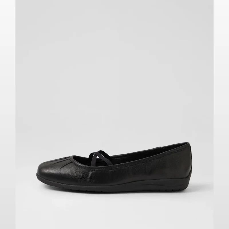 Side view of a black leather flat shoe with a subtle elastic strap across the vamp and a low heel.