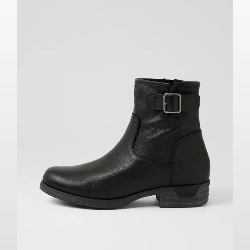 Side view of a black leather ankle boot with a buckle detail on the side and a low heel.