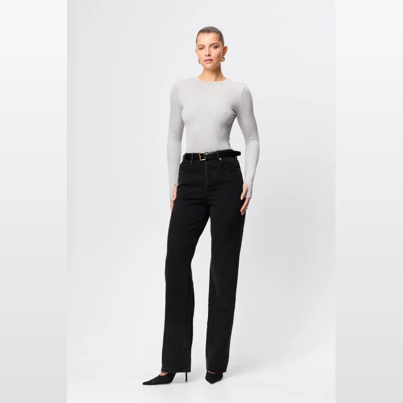 Model wearing Mossman Aspen Jeans in washed black denim, featuring a high-rise waist and straight-leg silhouette.