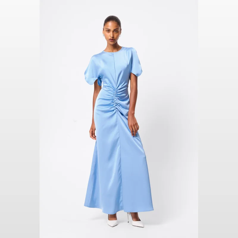 Woman wearing a sky blue Mossman Forgive & Forget Maxi Dress with split flutter sleeves and ruched detailing.